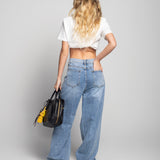 Calça De Ganga Com Vários Rasgos